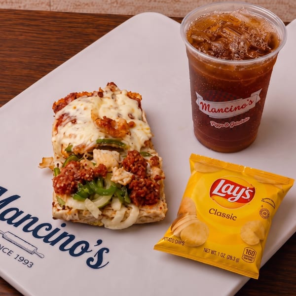 A BLT-style grinder combo with chips and a Mancino's drink.