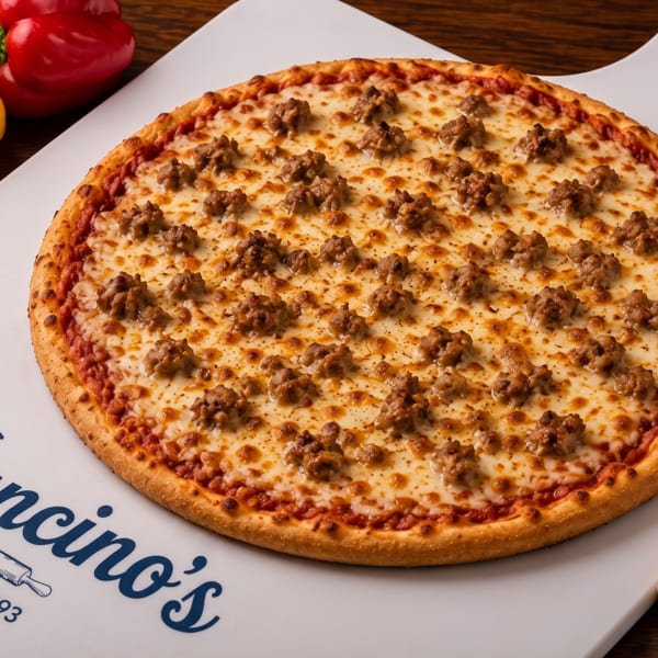 Mancino’s cheese pizza topped with browned sausage crumbles on a branded serving board, surrounded by peppers and mushrooms.